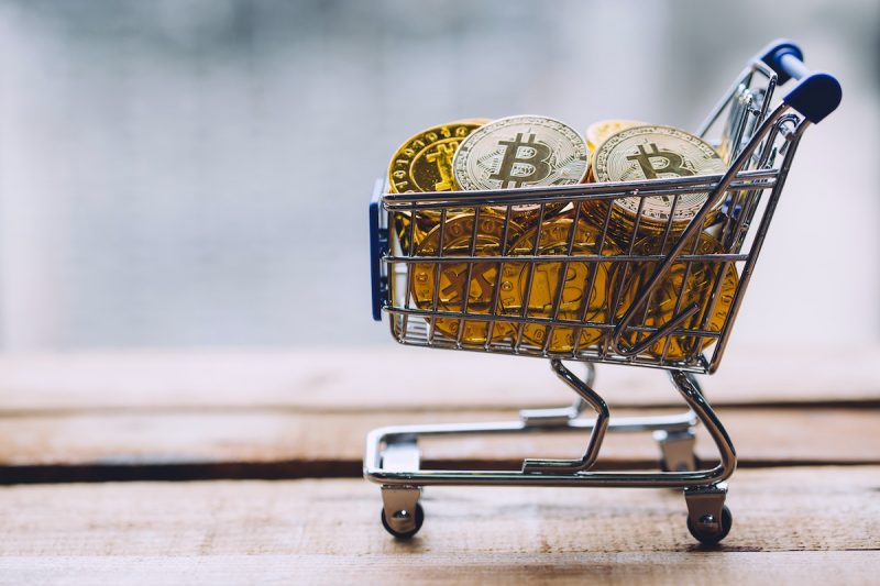 shopping-cart-filled-with-piles-of-cryptocurrency-2021-09-04-09-30-36-utc.jpg